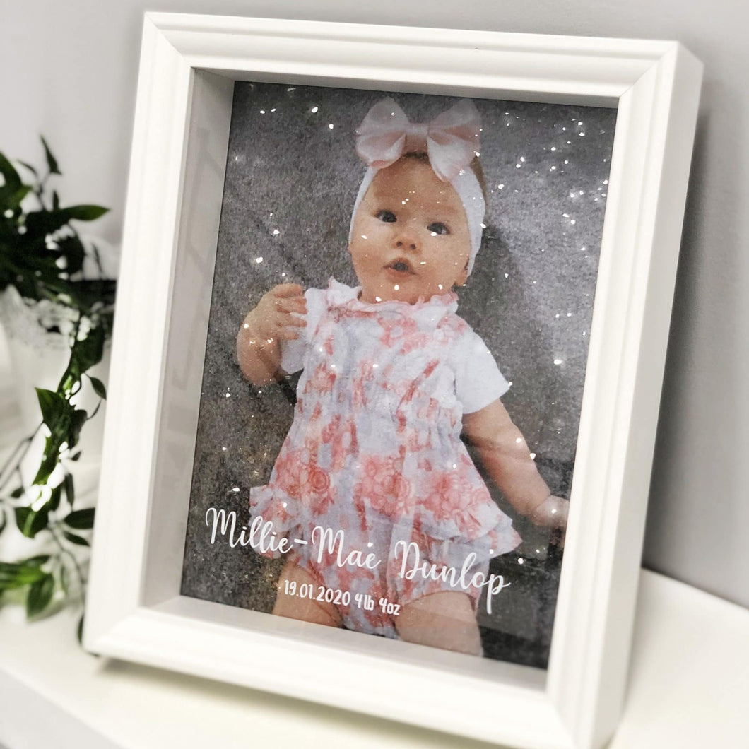 canvas baby photo in picture frame front view
